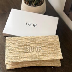 حقيبة يد أنيقة من ديور (Dior Beige Woven Pouch).