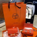 Hermès Constance Slim Wallet – Orange Epsom Leather مع كيس