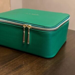 La Mer Green Travel-Style Makeup Bag with Stickers