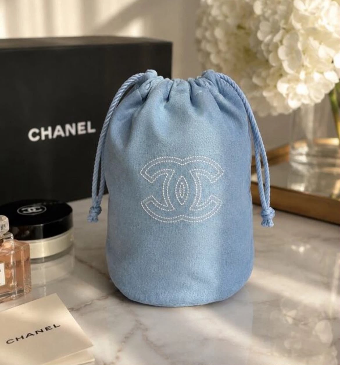 WhatsApp Image 2026-10-26 at 12.59.58 PM (1) Chanel Light Blue Denim Drawstring Pouch - الصورة 1
